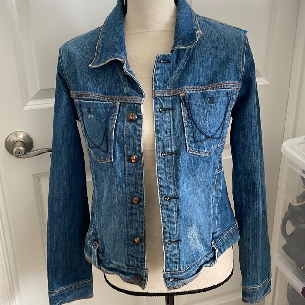 Adorable denim jacket with lots of cute accents.